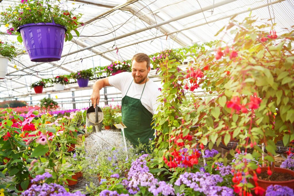 A gardener tending flowers at the farm